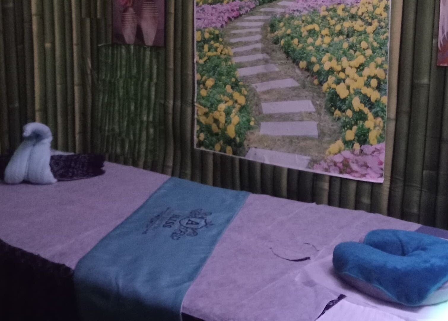 Serene massage room at Aliss Salon Beauty Spa, Kuah, Kedah, MY, featuring a tranquil decor.