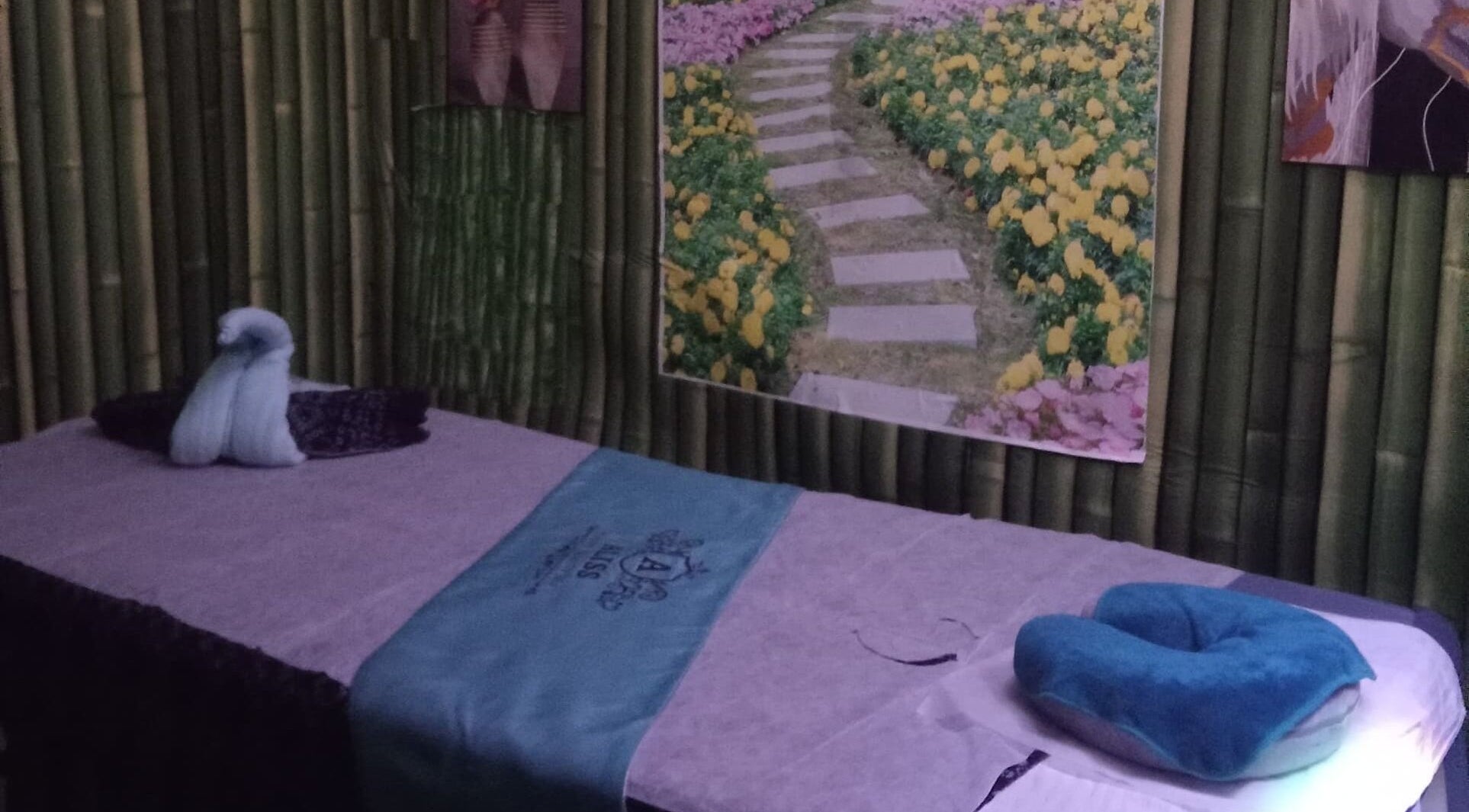 Serene massage room at Aliss Salon Beauty Spa, Kuah, Kedah, MY, featuring a tranquil decor.