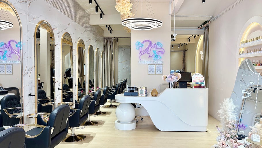 Chic interior of De Boss Hair & Nail Saloon in Johor Bahru, Johor Darul Ta'zim, MY featuring sleek chairs and decor.