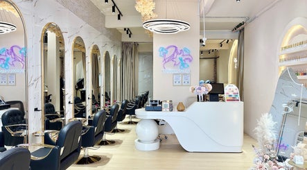Chic interior of De Boss Hair & Nail Saloon in Johor Bahru, Johor Darul Ta'zim, MY featuring sleek chairs and decor.
