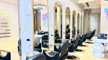 Chic interior of De boss hair & nail saloon in Johor Bahru, Johor Darul Ta'zim, MY with stylish chairs and mirrors.