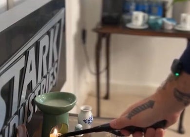 Candle being lit at Solo Chair, Royal Leamington Spa, England, GB for a calming ambiance.