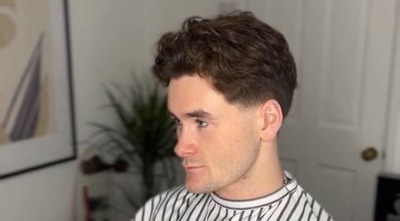 Man with trendy haircut at Solo Chair, Royal Leamington Spa, England, GB.
