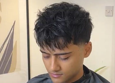 Gentleman's stylish haircut at Solo Chair, Royal Leamington Spa, England, GB.