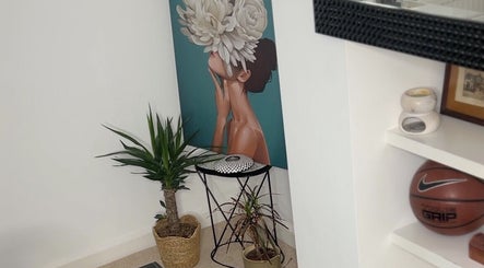 Artistic corner with floral artwork and plants at Solo Chair, Royal Leamington Spa, England, GB.