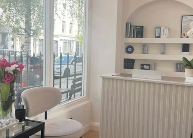 Welcoming reception at Reset Beauty, London, England featuring elegant decor and a bright window view.
