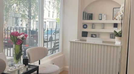 Welcoming reception at Reset Beauty, London, England featuring elegant decor and a bright window view.