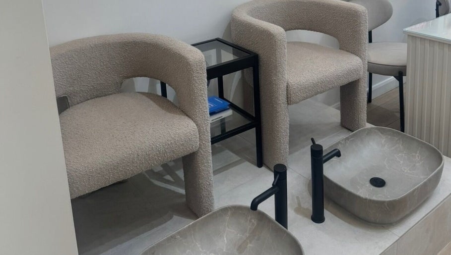 Modern pedicure chairs and basins at Reset Beauty, London, England, GB. Relaxing and stylish spa setting.