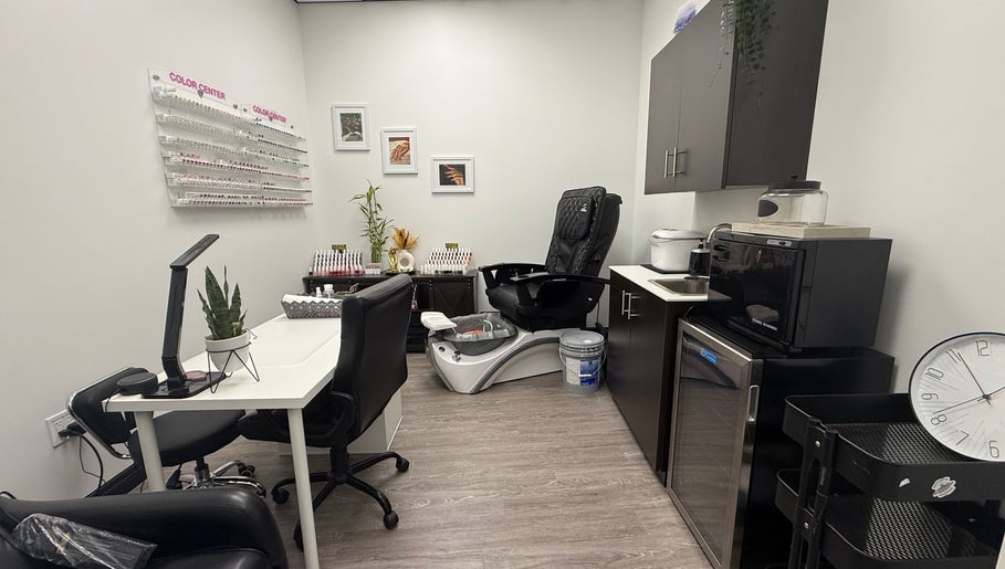 Modern nail salon at Artistry Nails Miami, Plantation, Florida, US, featuring pedicure chair and nail polish display.