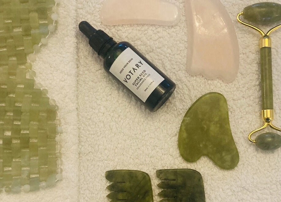 Skincare tools set at Skincare Studio Uk, Saffron Walden, England, GB, featuring jade roller and facial oil.