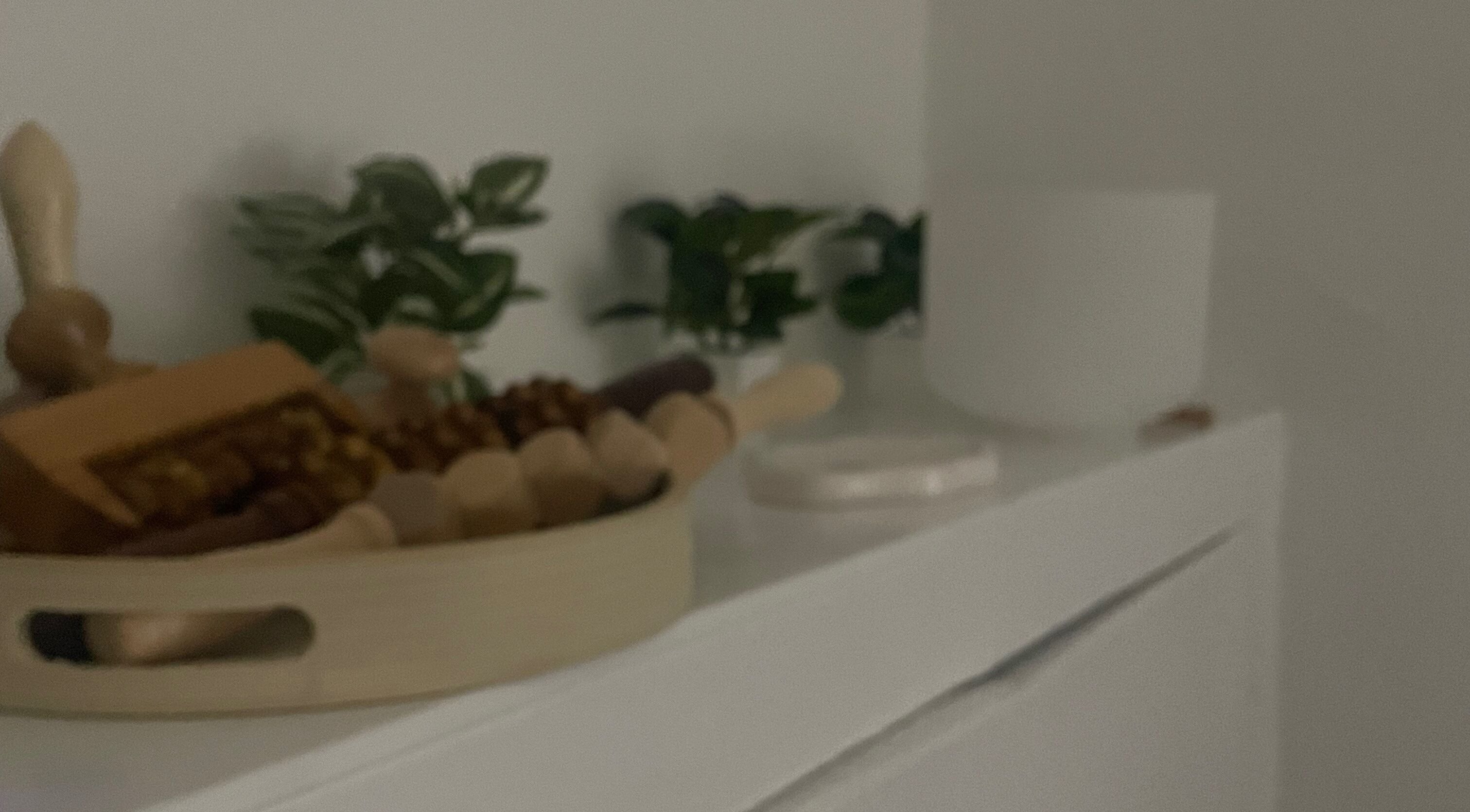 Wooden massage tools and green plants at Skincare Studio Uk, Saffron Walden, England, GB.