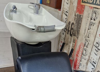 Washing station at The Garden Salon Hair Design, Colchester, England, GB, offering comfort and style.