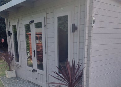 Elegant exterior of The Garden Salon Hair Design in Colchester, England, GB with modern wooden decor.