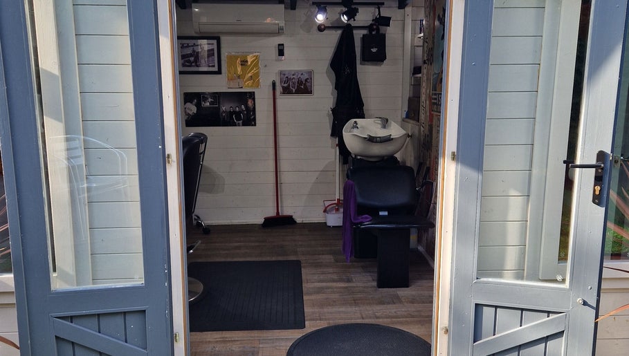 Entrance view of The Garden Salon Hair Design in Colchester, England, GB showing stylish interior.