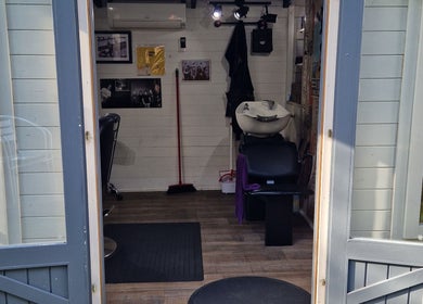 Entrance view of The Garden Salon Hair Design in Colchester, England, GB showing stylish interior.