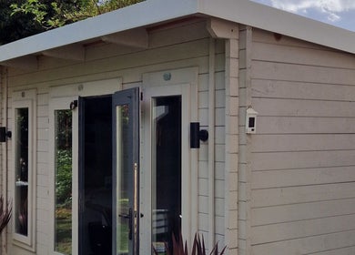 Charming garden studio at The Garden Salon Hair Design, Colchester, England, GB, offering peaceful wellness services.