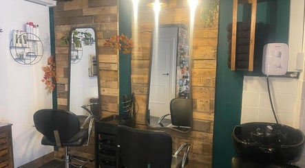 Warm and inviting salon setup at Hair by Bee at Beautifly nails and beauty in Halstead, England, GB, with wood accents.