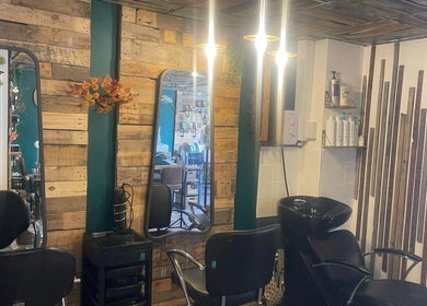 Trendy salon interior at Hair by Bee in Beautifly nails and beauty, Halstead, England, GB with rustic decor.