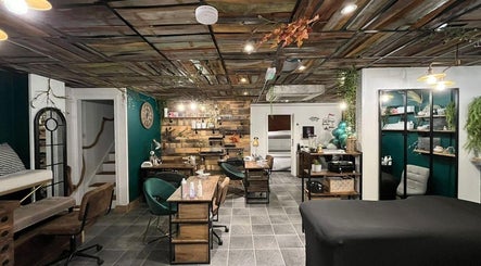 Stylish interior of Hair by Bee at Beautifly nails and beauty, Halstead, England, GB, featuring a rustic design.
