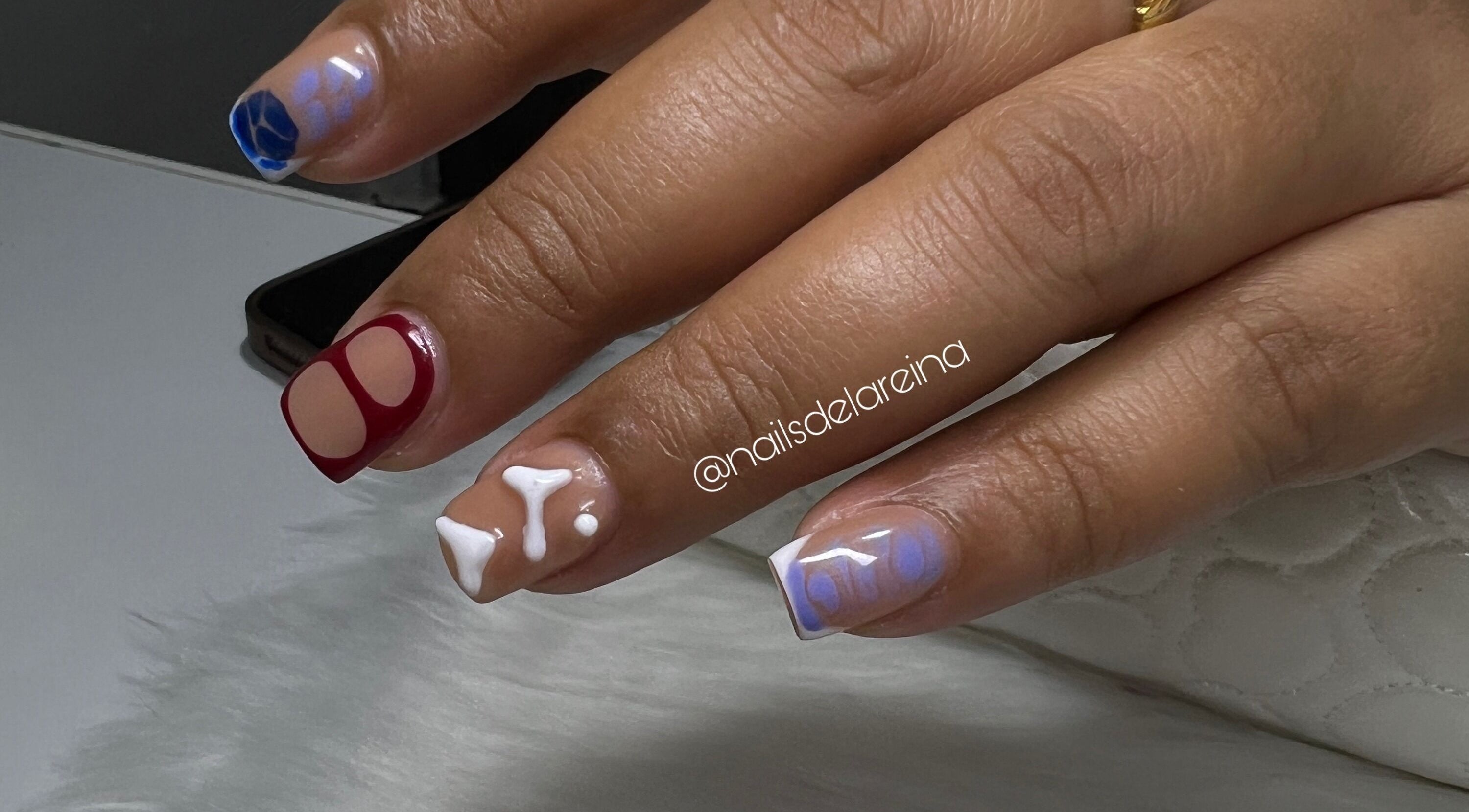 Intricate nail art design at Nails De La Reina in Wanica, Wanica, SR. Features bold colors and patterns.