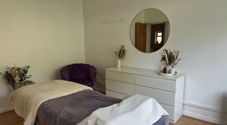 Relaxing treatment room at The Lash & Brow Co, Maidenhead, England, GB with cozy bed and stylish decor.