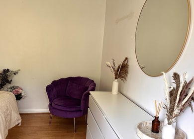 Cozy room with purple chair at The Lash & Brow Co, Maidenhead, England, GB.