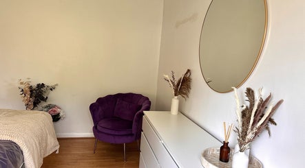 Cozy room with purple chair at The Lash & Brow Co, Maidenhead, England, GB.
