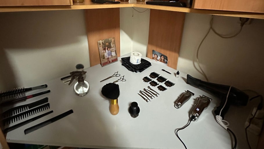 Barber tools neatly arranged on a white shelf at M_Barbershop, Briteiros (Santo Estêvão), Braga, PT.