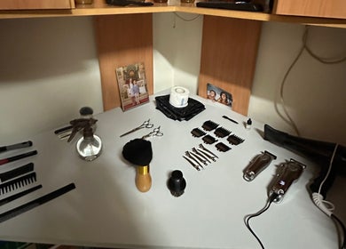 Barber tools neatly arranged on a white shelf at M_Barbershop, Briteiros (Santo Estêvão), Braga, PT.