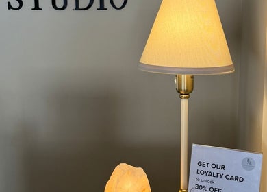 Cozy entrance at LN Beauty Witney in Witney, England, GB with a stylish lamp and loyalty card offer.