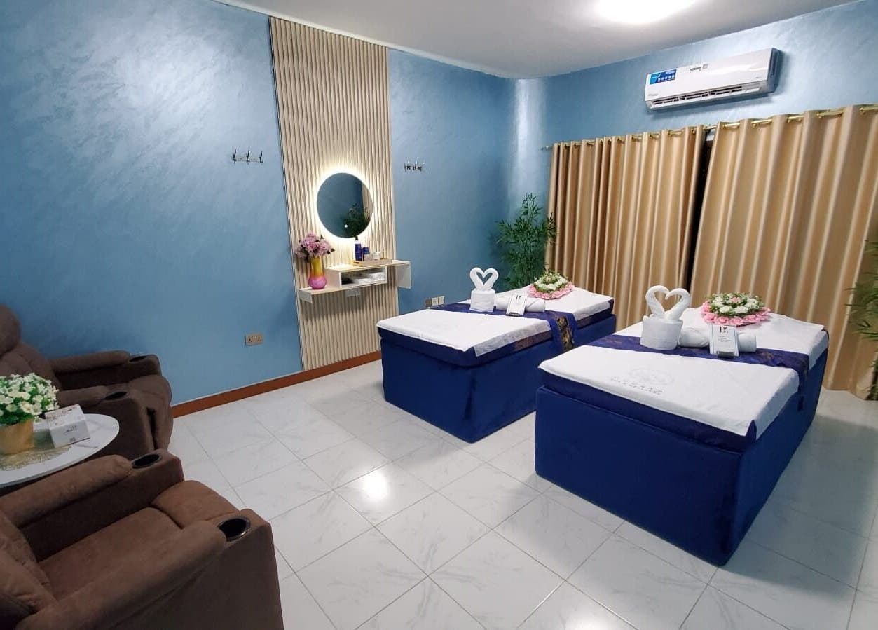 Luxurious massage room at Modiva Spa and Wellness, Al Ain, Abu Dhabi, AE, featuring plush massage tables and decor.