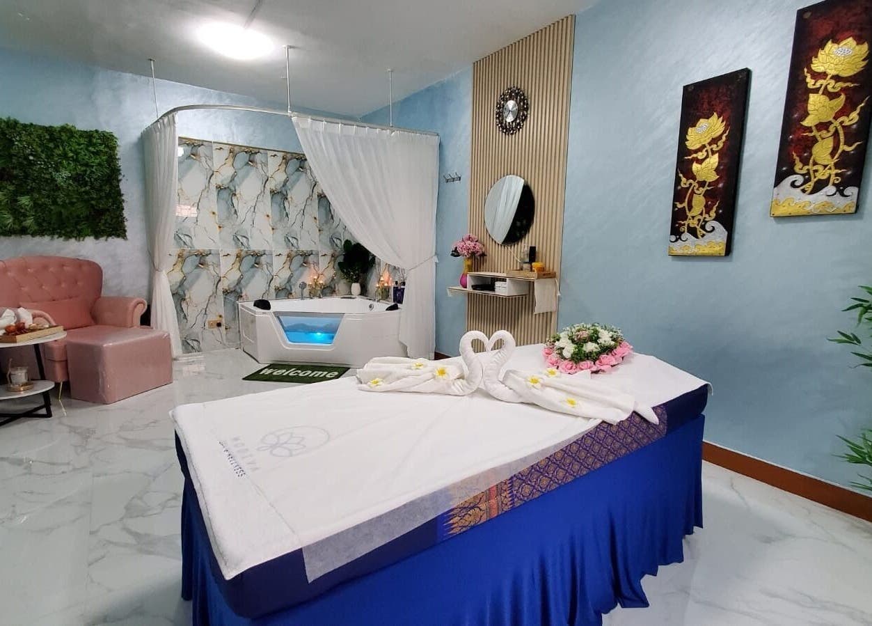 Luxurious treatment room at Modiva Spa and Wellness, Al Ain, Abu Dhabi, AE, featuring elegant decor and spa bed.