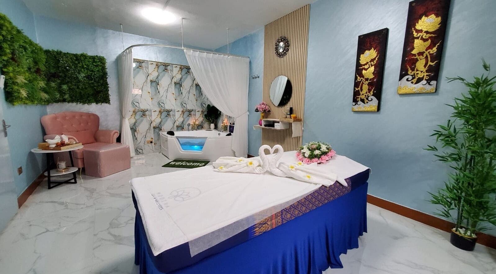 Luxurious treatment room at Modiva Spa and Wellness, Al Ain, Abu Dhabi, AE, featuring elegant decor and spa bed.