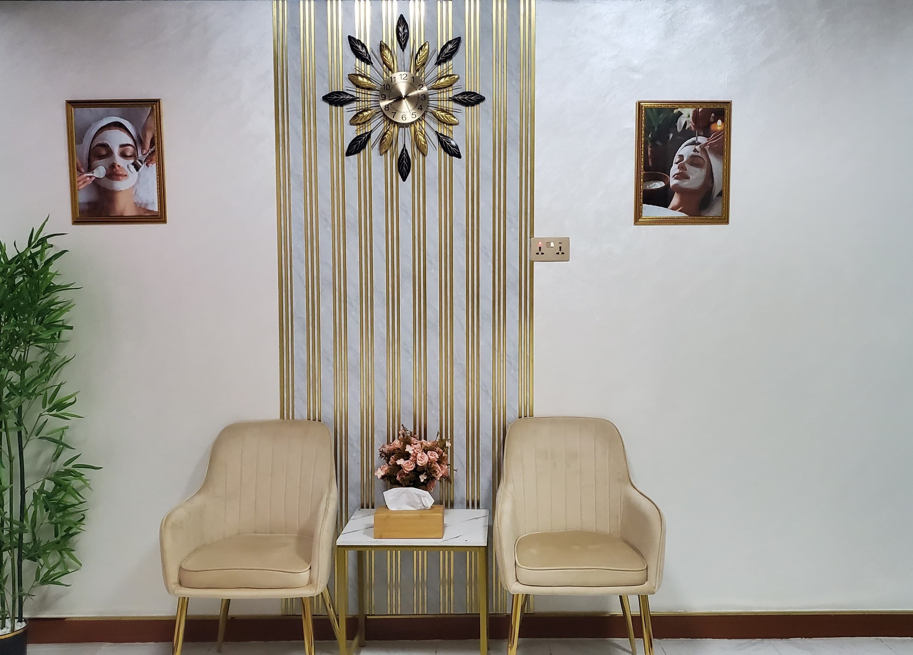 Elegant waiting area at Modiva Spa and Wellness, Al Ain, Abu Dhabi, AE featuring cozy chairs and wall decor.