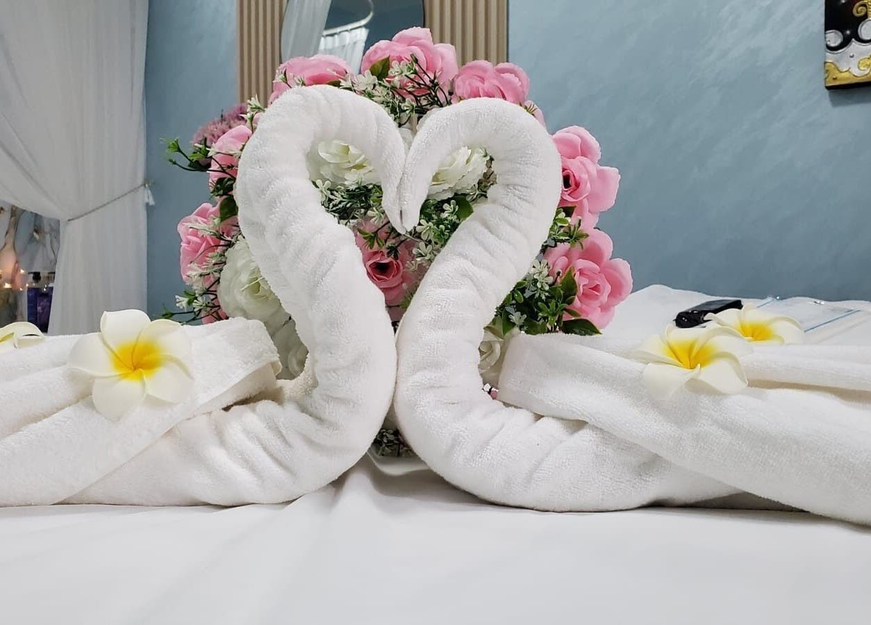 Elegant swan towel art with floral decor in Modiva Spa and Wellness, Al Ain, Abu Dhabi, AE.