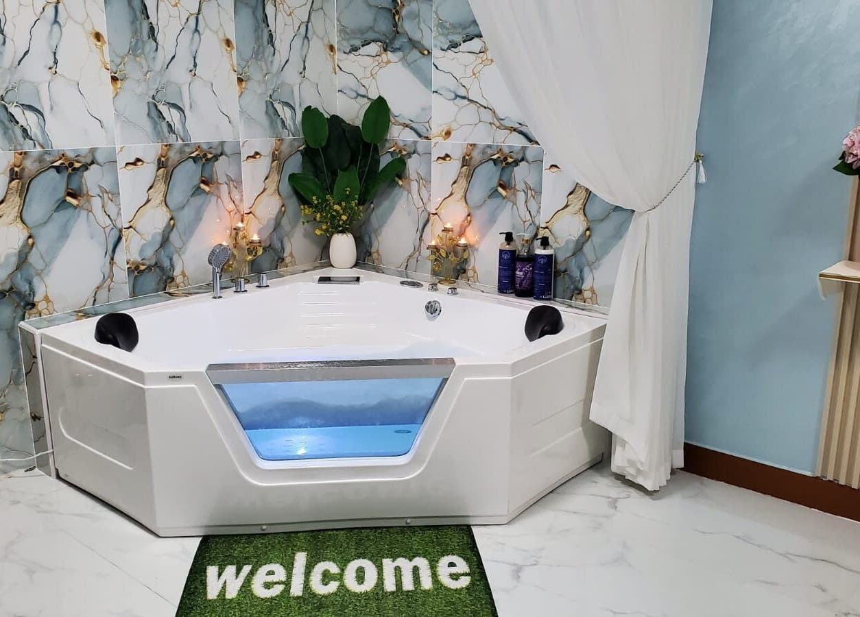 Elegant spa tub with candles at Modiva Spa and Wellness, Al Ain, Abu Dhabi, AE.