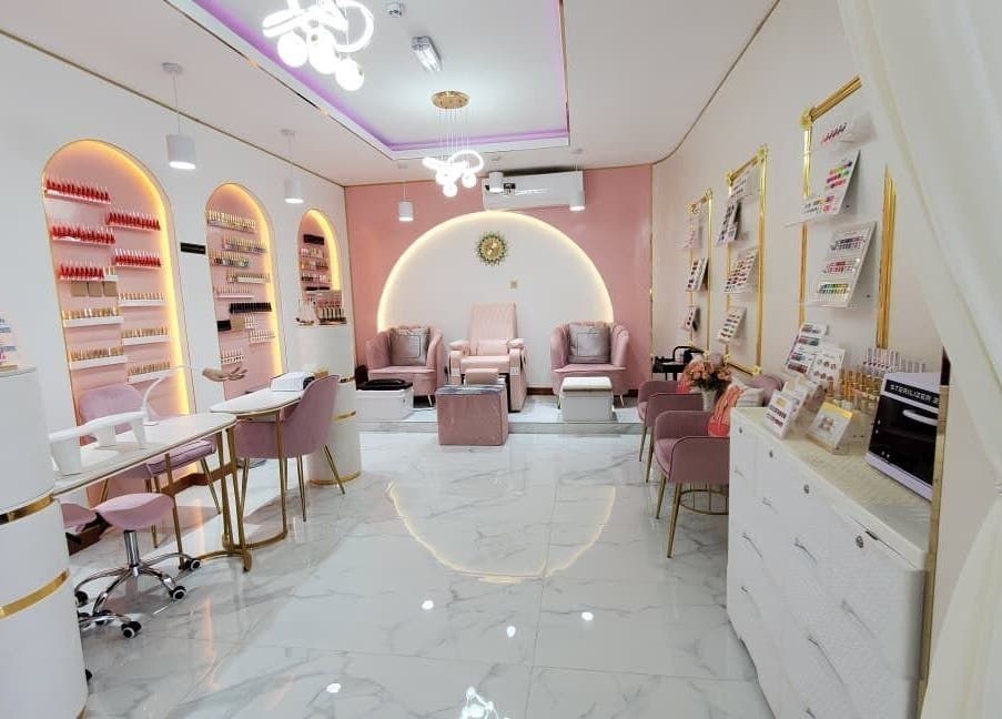 Elegant interior of Modiva Spa and Wellness in Al Ain, Abu Dhabi, AE, featuring pastel seating and modern decor.