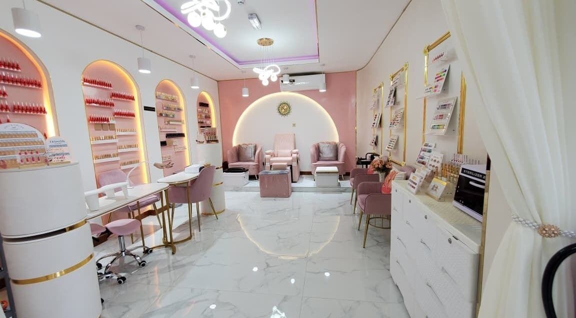 Elegant interior of Modiva Spa and Wellness in Al Ain, Abu Dhabi, AE, featuring pastel seating and modern decor.