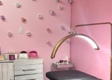 Cozy waxing room at Waxroomby_megz, Arima, Arima Borough Corporation, TT with floral decor and waxing equipment.