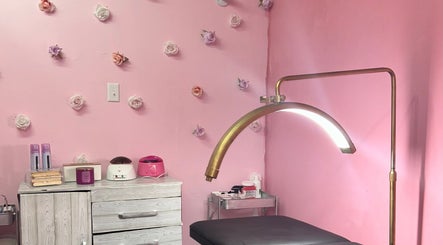 Cozy waxing room at Waxroomby_megz, Arima, Arima Borough Corporation, TT with floral decor and waxing equipment.
