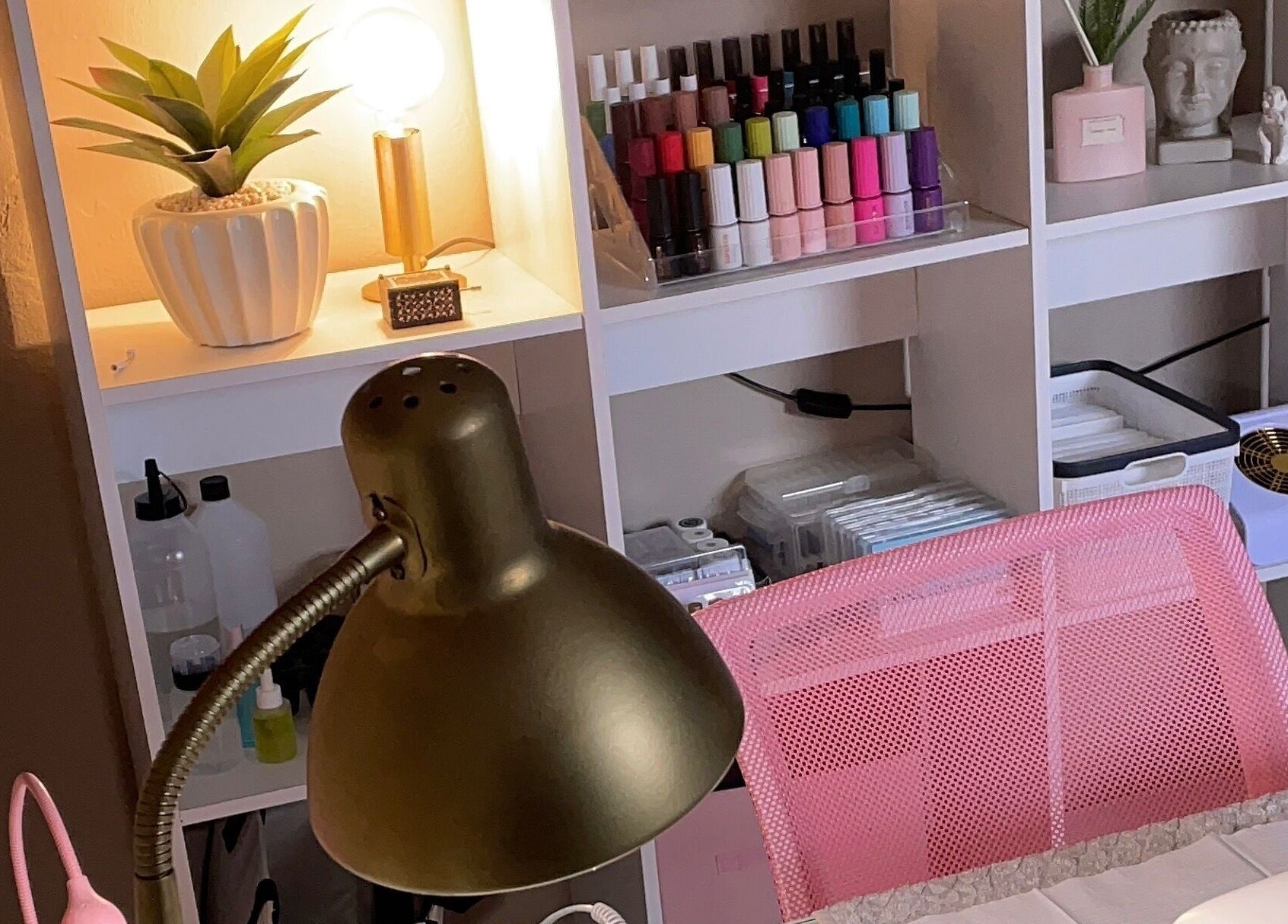 Elegant nail salon setup at Perfectly Pressed Studio, Johannesburg, Gauteng, ZA, featuring vibrant polish and decor.