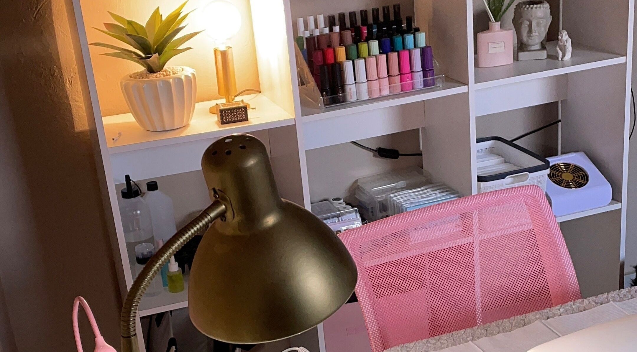 Elegant nail salon setup at Perfectly Pressed Studio, Johannesburg, Gauteng, ZA, featuring vibrant polish and decor.