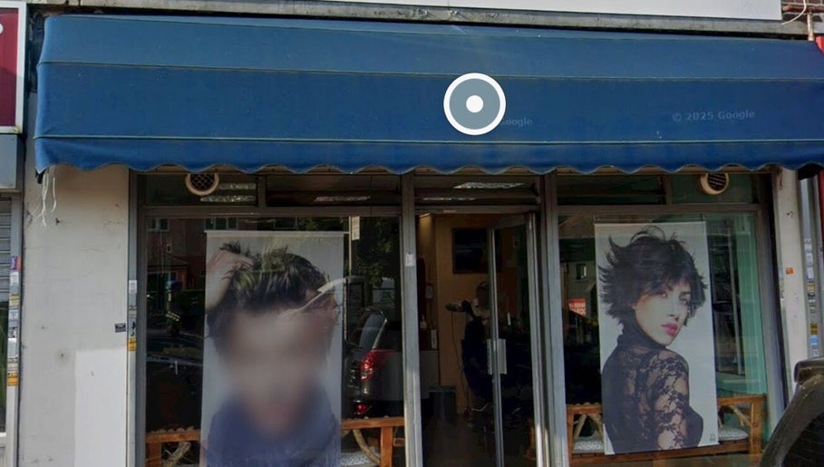 Front of Menova beauty salon in Greenford, England. Stylish images adorn the entrance.