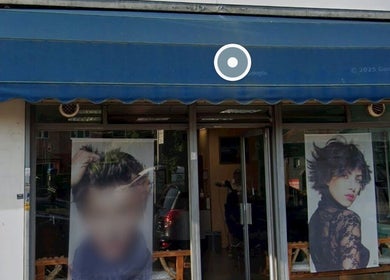 Front of Menova beauty salon in Greenford, England. Stylish images adorn the entrance.