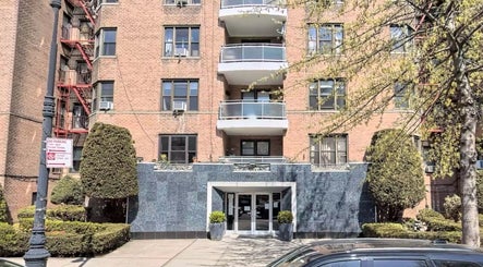 Front entrance of Carmenglitz.inc in New York, New York, US, showcasing elegant architecture.