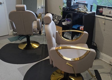 Elegant salon chairs at Beach Hair Affair in St. Petersburg, Florida, US, showing modern styling.