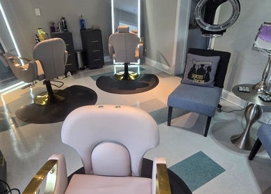 Modern salon at Beach Hair Affair in St. Petersburg, Florida, US featuring stylish chairs and decor.