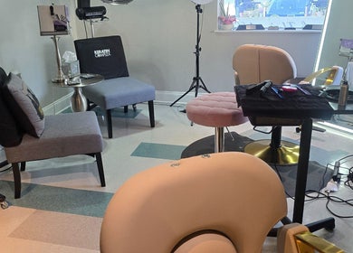 Chic salon interior of Beach Hair Affair, St. Petersburg, Florida, US with stylish chairs and lighting.