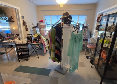 Interior of Beach Hair Affair, showing stylish clothing and accessories in St. Petersburg, Florida, US.