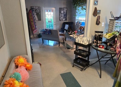 Inviting interior of Beach Hair Affair in St. Petersburg, Florida, featuring a welcoming seating area and beauty products.